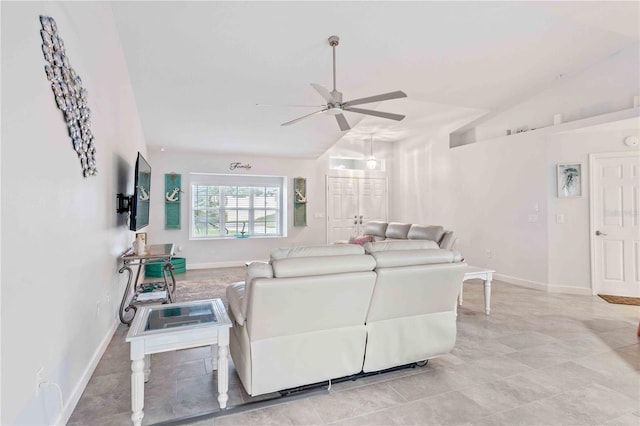 living room with ceiling fan and lofted ceiling