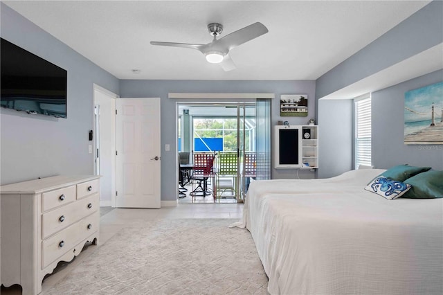 tiled bedroom featuring ceiling fan and access to exterior