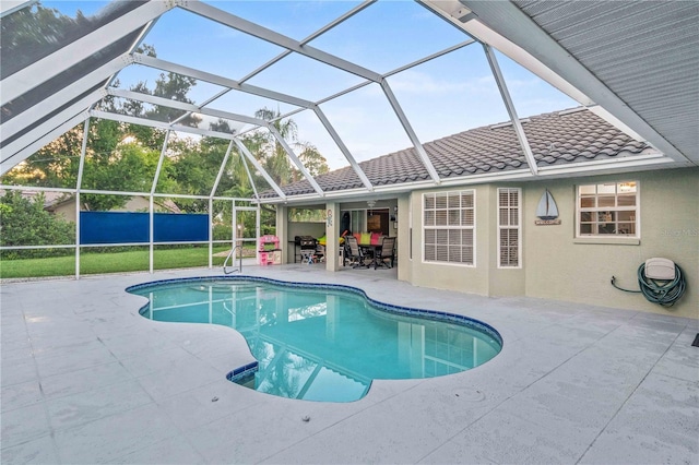 view of pool with a lanai and a patio area