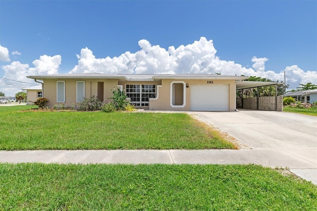 ranch-style home with a garage, a carport, and a front yard