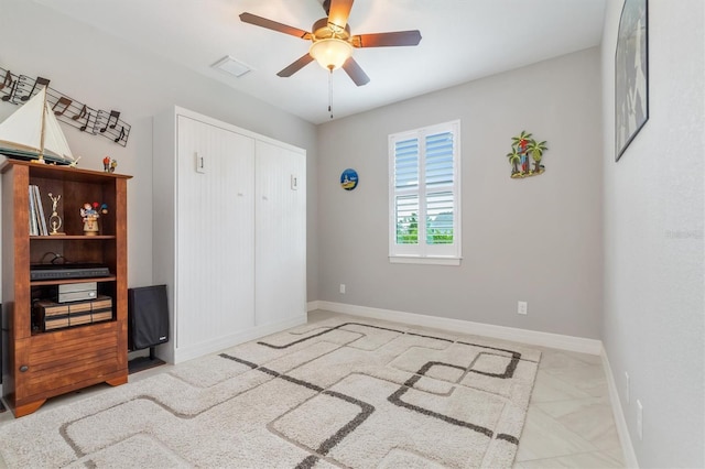 bedroom featuring a closet and ceiling fan