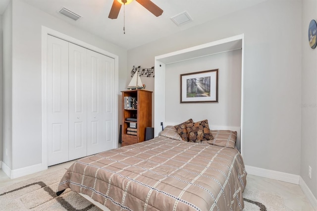 bedroom with ceiling fan and a closet