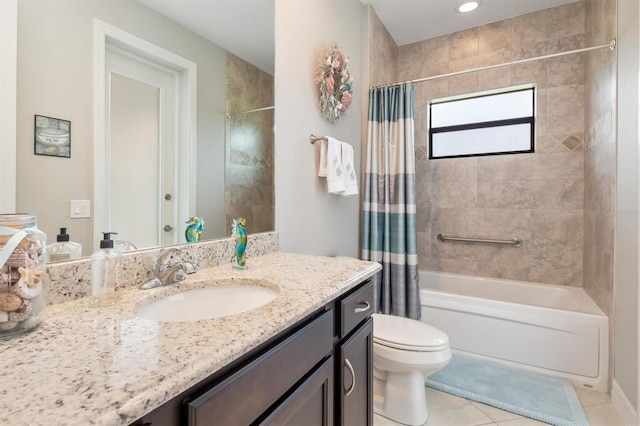 full bathroom with vanity, tile patterned floors, toilet, and shower / bath combo