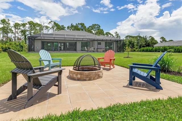 view of patio featuring a lanai and a fire pit