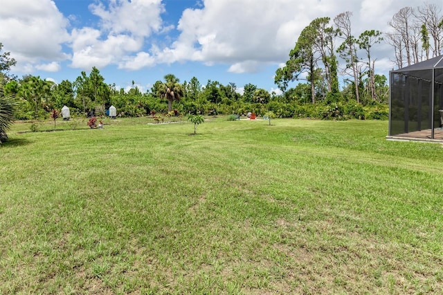 view of yard featuring a lanai