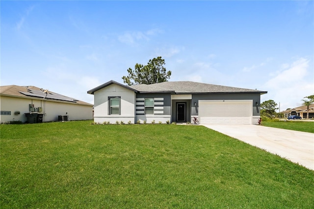 view of front of house featuring a garage and a front lawn