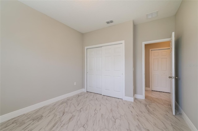 unfurnished bedroom with a closet