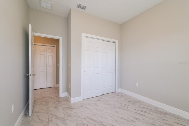 unfurnished bedroom with a closet