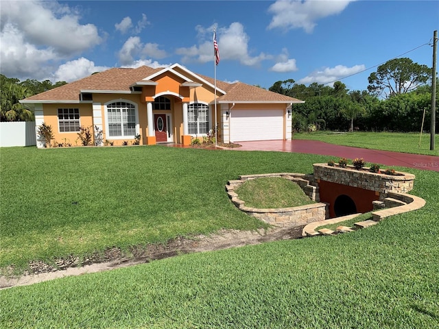 ranch-style house with a garage and a front yard