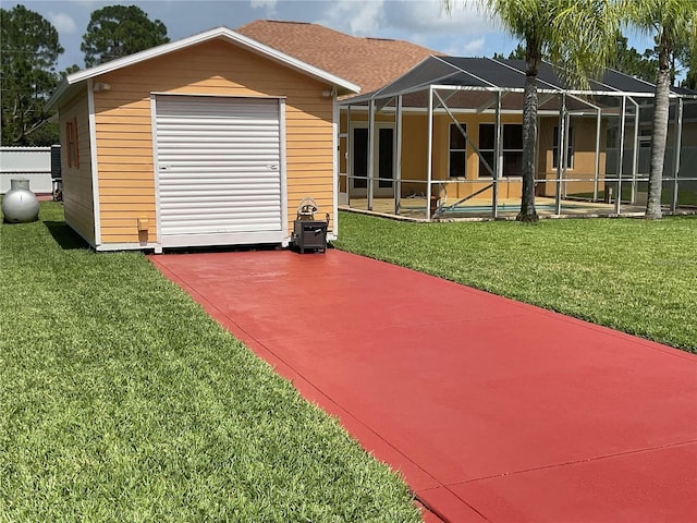 back of property with a patio area, a lanai, a yard, and a pool