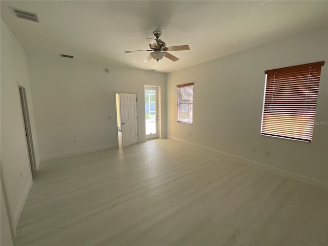 unfurnished room with light hardwood / wood-style floors and ceiling fan