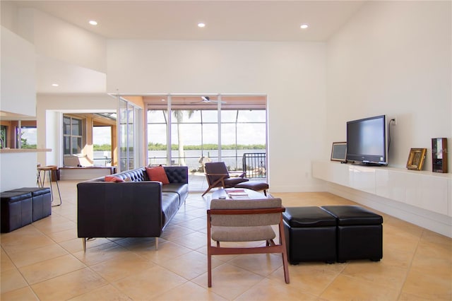 tiled living room with a high ceiling