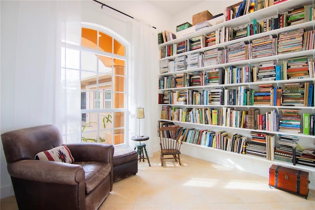 sitting room with light tile patterned floors