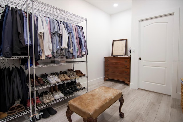 walk in closet featuring light hardwood / wood-style flooring