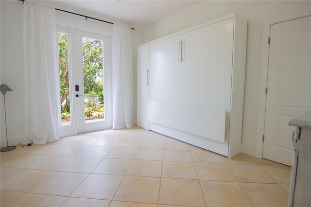 unfurnished room with light tile patterned floors