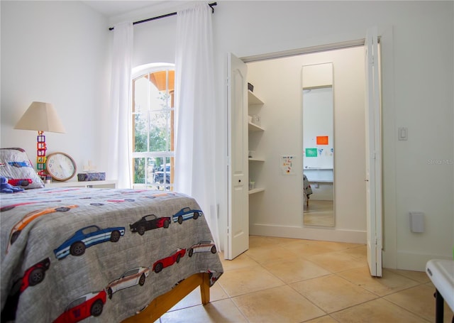 bedroom with light tile patterned flooring