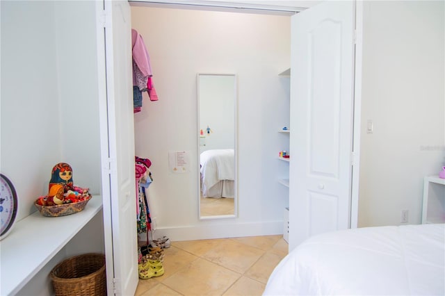 bedroom with light tile patterned flooring