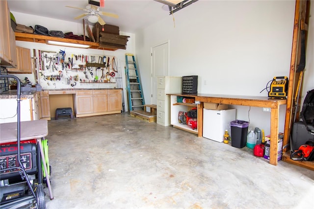 garage featuring ceiling fan and a workshop area