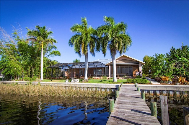 dock area with a water view and glass enclosure