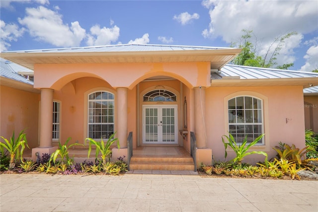 property entrance featuring french doors