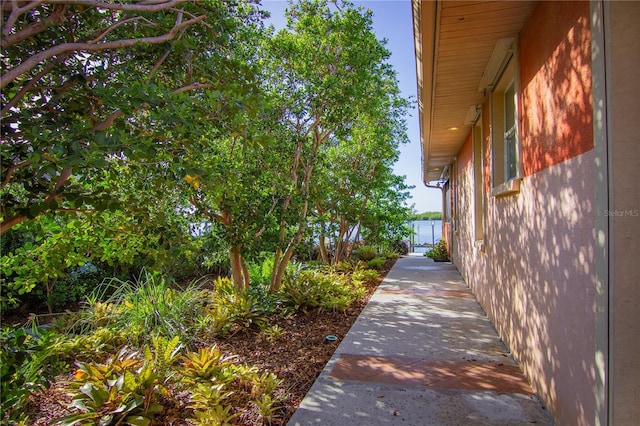 view of side of home featuring a water view