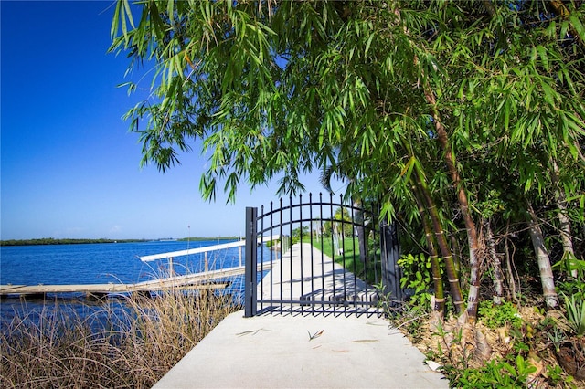 view of gate featuring a water view