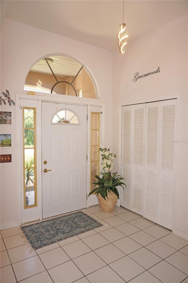 entrance foyer with light tile patterned floors