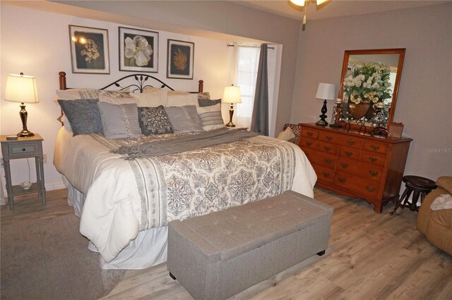 bedroom with light hardwood / wood-style flooring