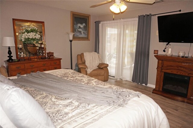 bedroom featuring hardwood / wood-style floors and ceiling fan