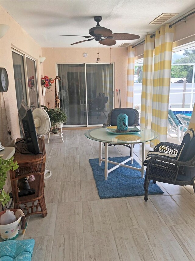 view of patio featuring ceiling fan