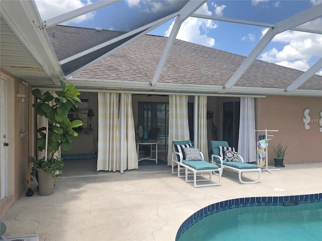 rear view of house featuring a patio and a lanai