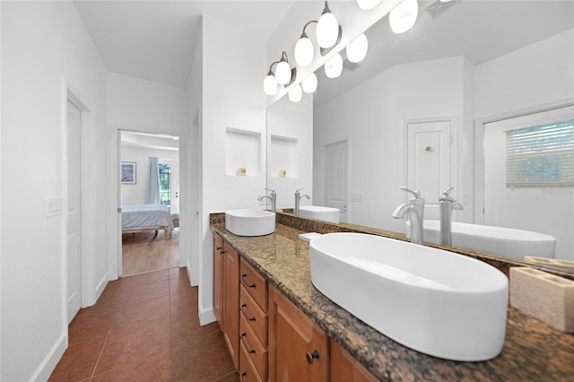 bathroom featuring tile patterned floors and vanity