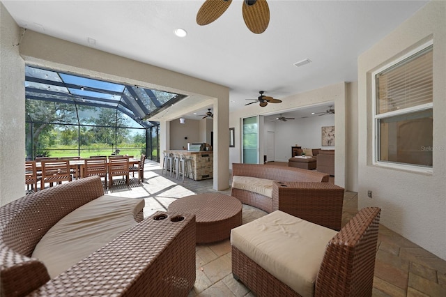 interior space featuring a patio area, an outdoor living space, and a bar