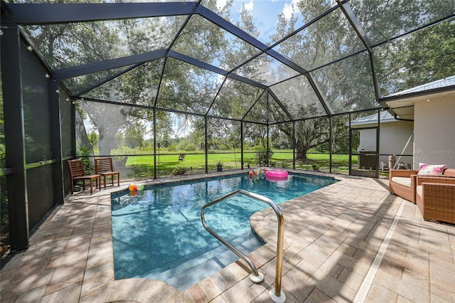 view of pool featuring a patio and glass enclosure