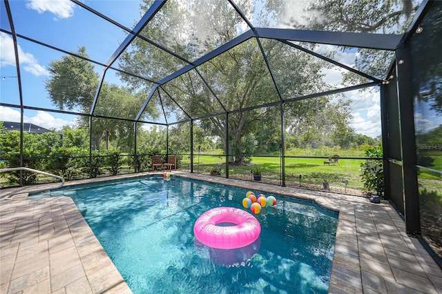 view of swimming pool featuring a lanai and a patio