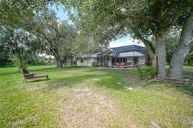 view of yard featuring glass enclosure