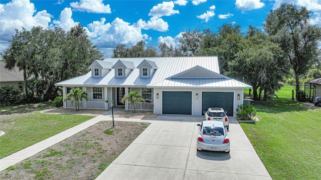 view of front of home featuring a front lawn, a porch, and a garage