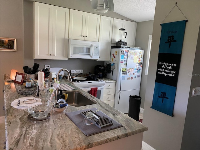 kitchen with white cabinetry, white appliances, kitchen peninsula, a textured ceiling, and sink