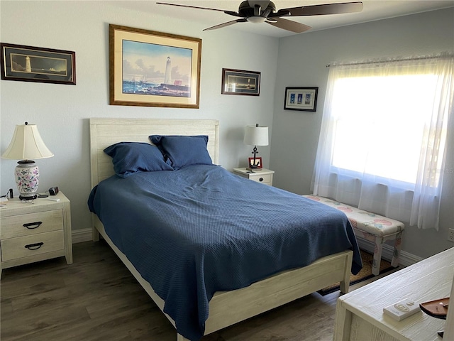 bedroom with dark wood-type flooring and ceiling fan