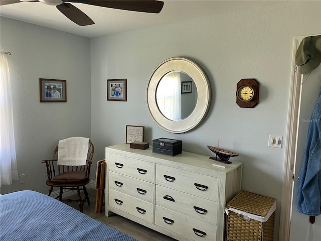 bedroom with dark wood-type flooring and ceiling fan