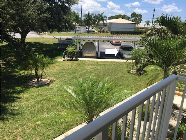 view of yard with a balcony