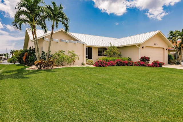 ranch-style home with a front lawn and a garage