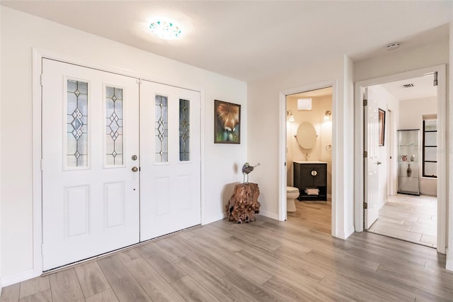 entrance foyer featuring hardwood / wood-style floors