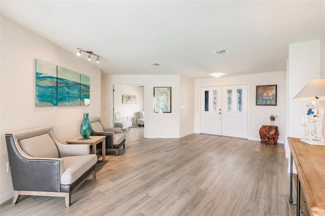 sitting room with light hardwood / wood-style floors