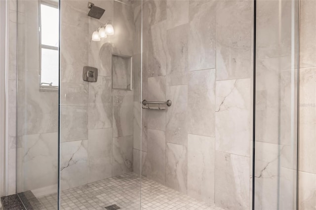 bathroom with tiled shower