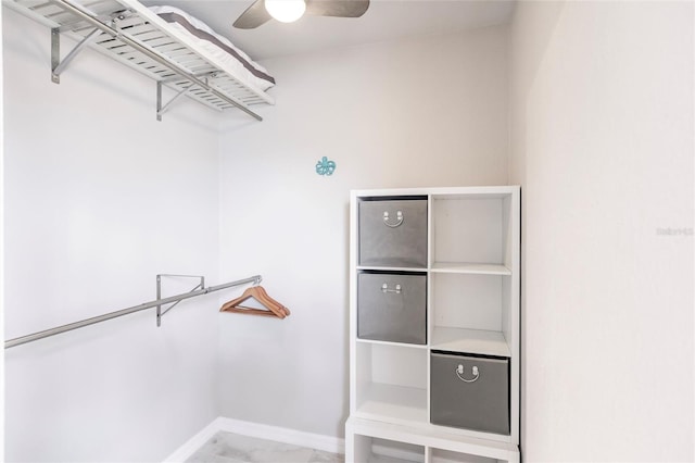 spacious closet featuring ceiling fan