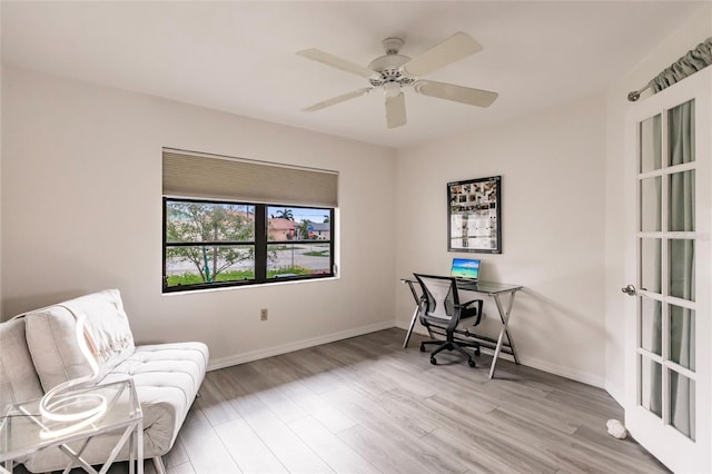 office area with ceiling fan and light hardwood / wood-style floors