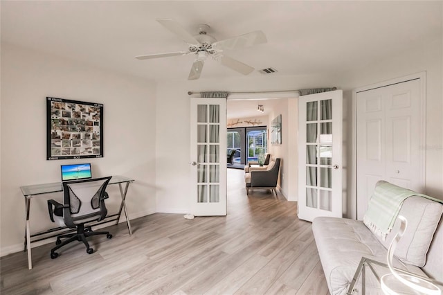 office area featuring ceiling fan, french doors, and light hardwood / wood-style floors