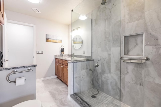 bathroom with vanity, an enclosed shower, and toilet