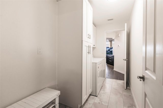 hallway with washer / clothes dryer